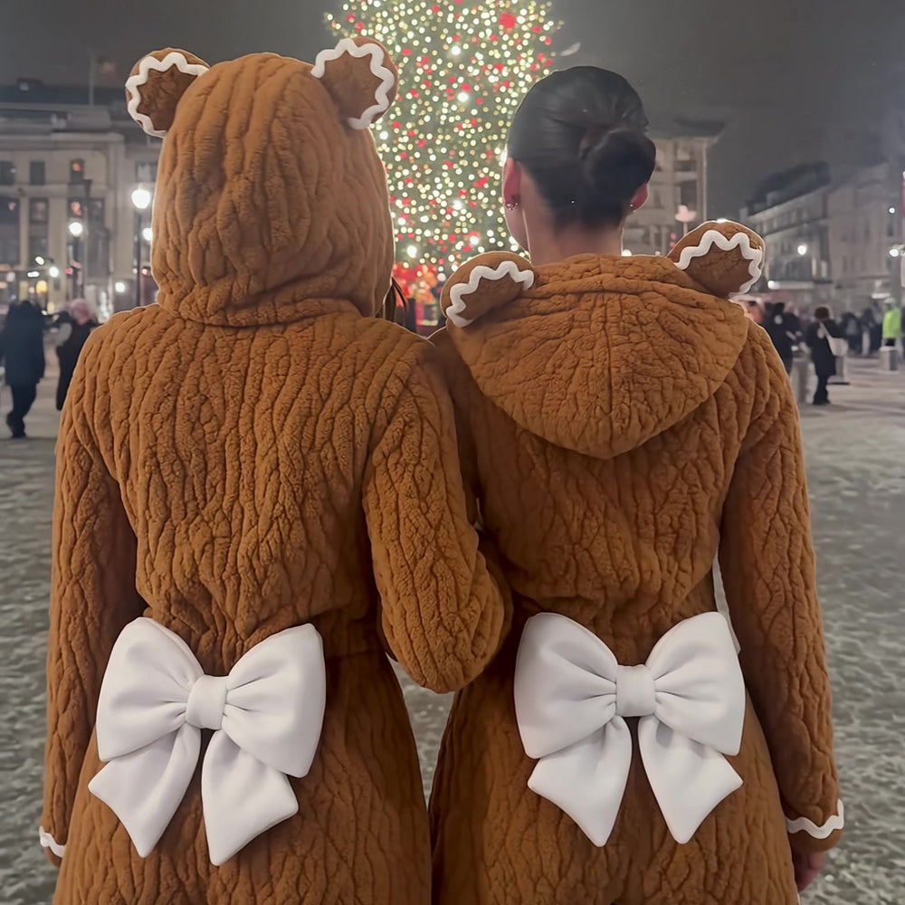 Best friends in matching rompers at the Christmas tree