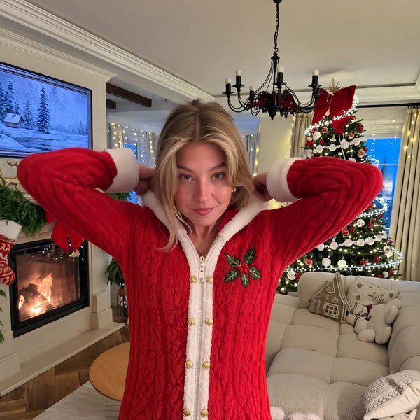 Mrs. Claus Cozy Romper worn by the fireplace